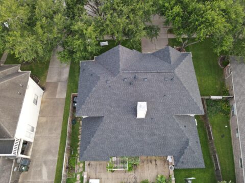 Aerial view of home roofing replacement performed by Pearl Roofing in HoustonTexas